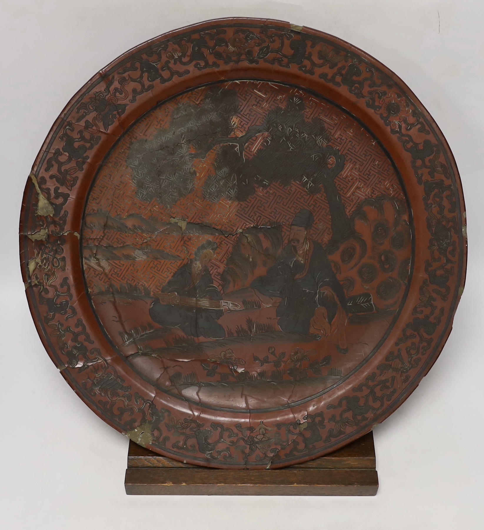 An 18th century Chinese polychrome lacquer large dish on stand, 45.5cm